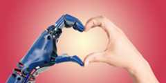 A robot hand and a human hand come together to form the shape of a heart, symbolizing the connection between humans and technology. The background is a gradient of warm pink and red hues, radiating towards the center of the image.