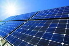 solar panels with sun shining on them from above