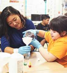 UT staff volunteering in an elementary school