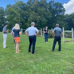 Visitors tour a vineyard at Highland Manor