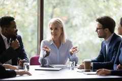 Mature leader boss give helpful information to young diverse professionals