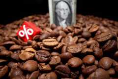 FILE PHOTO: Illustration shows coffee beans and U.S. dollar banknote
