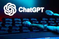 FILE PHOTO: Illustration shows ChatGPT logo, keyboard, and robot hands