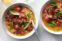 Brothy Tomato Rice Soup. Let late-season tomatoes shine by simmering them whole, vines and all, Eric Kim writes. Food Stylist: Simon Andrews. (David Malosh/The New York Times)