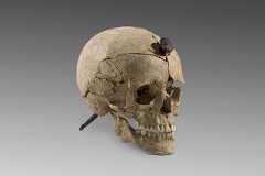 In an undated photo from the Archaeology Museum of Catalonia, one of several severed heads with nails through them found at Ullastret, a settlement site in northern Spain dating from the Iron Age. (Archaeology Museum of Catalonia via The New York Times)