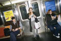 Sarah Jessica Parker reads while commuting on the subway in New York on Oct. 24, 2025. (OK McCausland/The New York Times)