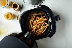 A batch of French fries in an air fryer in New York in October 2018. Food styled by Simon Andrews. (David Malosh/The New York Times)