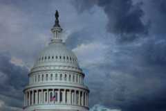 Close-up of the U.S Capitol with gathering storm clouds