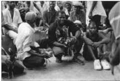 Fig. 4 - A favourite past-time of rural Haitian men; the cockfight, or gaguerre (or gagé) in Cazale 