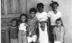 Fig. 33 - Poloné children at the home of Andléne Garcon; teacher and leading GCDC member  Ultimately, one can see that with dévlopman, Polishness is only an asset in the sense that it sets the Cazaliens in a unique position with a unique history. Their special history can even be seen as a counterweight to the request for developmental aid; ‘we might be poor, but we’re spe- cial, we have a heroic history, our ancestors fought for freedom.’ 