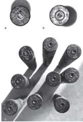 Fig. 38.7: Examples of firing pin impressions from 8 mm (7.92 mm) Mauser cartridges found in 2014 (photographs by Henry Pelgrift): (a) deep rectangular firing pin impression — SB Star | 47. (b) deep oval firing pin impression — Z Star 10 47. (c) shallow round firing pin impressions. 