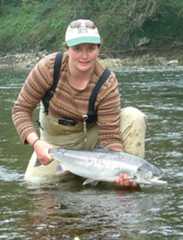 Glenda Powell releases a salmon
