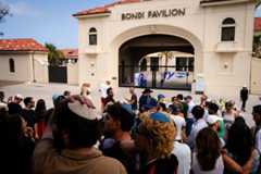People gather to mourn in the wake of a mass shooting outside Bondi Pavilion at Bondi Beach on December 15, 2025 in Sydney, Australia.