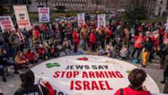 Demonstrators from the group Jewish Voice for Peace hold an emergency Passover Seder outside of ICE headquarters on April 14, 2025 in New York City. The group is calling for freedom for Palestine, the release of Mahmoud Khalil, and to protest President Trump.