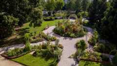 The Victory Garden at the National Museum of American History with winding paths along garden beds of fruits and vegetables.