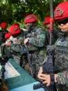 Taiwanese soldiers handle their guns during an anti-landing defense drill in New Taipei City.