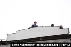 Saakashvili speaks from the roof of his apartment building before being detained.