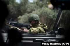 Российский военный конвой возле сирийского города Хама, май 2016 г.