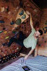 Cody climbing on the LED Rock Wall with his app