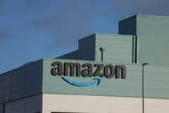 The Amazon logo is displayed outside the Amazon UK Services Ltd Warehouse on January 30, 2025 in Warrington, United Kingdom.