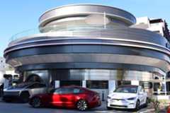 Tesla Diner with Teslas parked in front of it