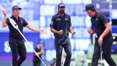 Tony Finau, Collin Morikawa and Sahith Theegala react to a putt during their TGL match against New York Golf Club.