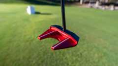 Odyssey TriHot S2S putter on golf green.