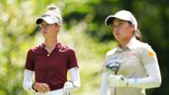 Nelly Korda looks on as Jeeno Thitikul plays a shot