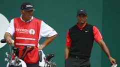 Caddie Steve Williams for Adam Scott (not seen) stands by Tiger Woods at the 2013 Open Championship.