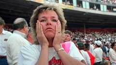 A fan reacts to the shaking at the park in October 1989 just after the Loma Prieta earthquake. 