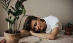 woman sleeping with pots around