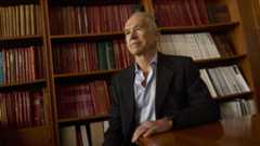 Alberto Ascherio sitting in front of a bookshelf.