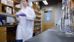 Blurry image of person in lab