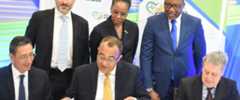 Minister of Health and Wellness Dr Christopher Tufton (seated at centre) and Borislav Stoyanov (seated at right) sign the design contract for the development of 13 health facilities in Jamaica. Sharing in the moment are IDB team lead for the programme Ricardo Enrique Perez-Cuevas (seated at left) and (standing from left) Gabrio Marinozzi of the European Union; Dr Karen Webster-Kerr, Acting Chief Medical Officer; and Dunstan Bryan, Permanent Secretary in the Ministry of Health and Wellness.
