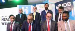 Dr. the Hon. Christopher Tufton (second from left) and Dr. John Parry (second from right), Clinical Director of the UK firm, The Phoenix Partnership (TPP) sign the agreement for the implementation of the Electronic Health Records System to Jamaica. Sharing in the occasion at the Spanish Town Hospital on Tuesday, February 28 are Mr. Tariq Alli (seated left), IDB Group General Manager Country Department Caribbean Group and Country Representative in Jamaica; and Mr. Orett Clarke, Programme Manager for the Health Systems Strengthening Programme (HSSP) of the Ministry of Health & Wellness. They are joined by (standing from left) Dr. David Jemmott, EHR Lead, HSSP; Mr. Ashley Brook, Director at TPP; Mr. Anton Ilarionov, Component 2 Lead, HSSP; and His Excellency Daniel Shepherd, Deputy British High Commissioner to Jamaica.