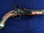 The 250-year-old antique pistol was taken from an Italian museum as a souvenir by a British soldier. Sgt Stanley Parry intervened as the man was about to throw it in the sea and kept it himself