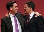 Labour Party leader Ed Miliband (L) greets his brother David onstage during the Labour Party conference today