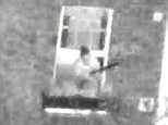 Police helicopter footage shows Mark Saunders waving a shotgun outside the window of his flat moments before he was shot by police marksmen