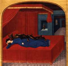A 15th-century illustration of Merlin's mother laying in a bed with a demon