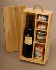 a wine bottle in a wooden box with spices and condiments next to it