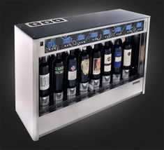 a wine dispenser with several bottles of wine in it's display case