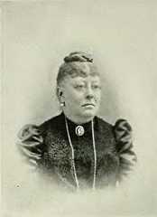 an old black and white photo of a woman with her head turned to the side