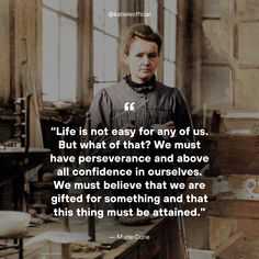 a man standing in front of a desk with a quote on it that says life is not easy for any of us but what of that? we must have