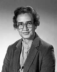 black and white photograph of an older woman wearing glasses