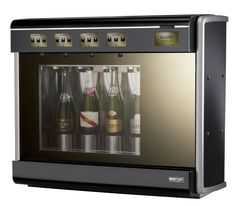 a wine cooler with four bottles in it