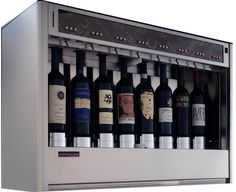 several bottles of wine are lined up in a display case on a white background,
