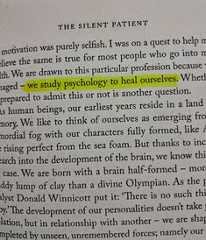 a close up of text on a piece of paper with an image of a person's face