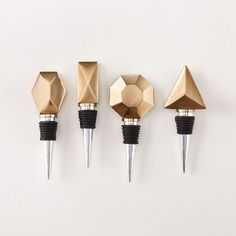 three different types of diamond shaped wine stoppers