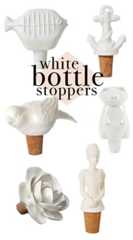 white bottle stoppers with different shapes and sizes on them, including an ice cream cone
