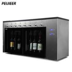 the wine dispenser has three bottles in it